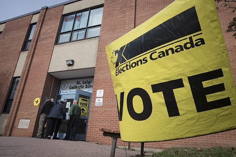 Voters enter a polling station in Toronto on Oct. 21, 2019 (Tijana Martin/CP)
