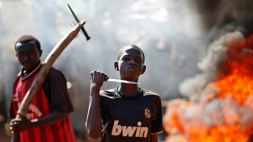 A boy gestures in front of a barricade after French troops opened fire at protesters in the Central African Republic town of Bambari. Goran Tomasevic/Reuters.