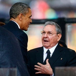 U.S. President Obama greets Cuban President Castro at the memorial service for Mandela in Johannesburg