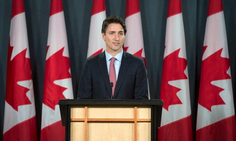 Prime minister-designate Justin Trudeau attends his first official news conference at the National Press Theatre in Ottawa, Tuesday Oct.20, 2015. THE CANADIAN PRESS/Adrian Wyld