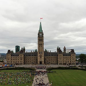 MPs and Senator pose for a group photo on the front steps of Parlaiment in Ottawa. Photo by Dave Chan.