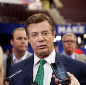 Trump Campaign Chairman Paul Manafort talks to reporters on the floor of the Republican National Convention at Quicken Loans Arena, Sunday, July 17, 2016, in Cleveland. (AP Photo/Matt Rourke)