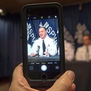 Montreal Chief of Police Philippe Pichet is recorded with a mobile device as he speaks to the media about the tapping of a newspaper reporter's smart phone at a news conference, Monday, October 31, 2016 in Montreal. (Ryan Remiorz/CP)