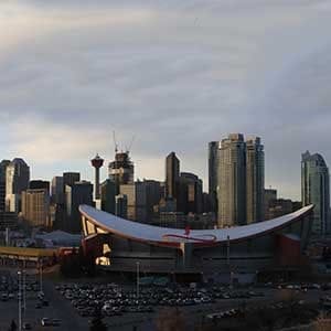 CALGARY, CANADA - FEBRUARY 25: A view of the exterior of the Scotiabank Saddledome home of the NHLâs Calgary Flames with the city skyline in the background on February 25, 2016 in Calgary, Alberta. (Photo by Tom Szczerbowski/Getty Images)