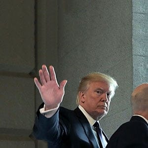 U.S. President Donald Trump (C) waves to journalists as he arrives at the U.S. Capitol for a meeting with the House Republican conference November 16, 2017 in Washington, DC. Trump is huddling with House GOP members on the day they hope to pass tax reform legislation, moving the president one step closer to a promised tax cut for corporations and some individual Americans before the end of the year. (Chip Somodevilla/Getty Images)