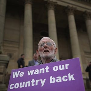 A Vote to Leave campaigner holds a placard as Leader of the United Kingdom Independence Party (UKIP), Nigel Farage campaigns for votes to leave the European Union in the referendum on May 25, 2016 in Bolton, England. Nigel Farage took his battle bus to Bolton encouraging British people to vote to leave the EU on 23rd June 2016. (Christopher Furlong/Getty Images)