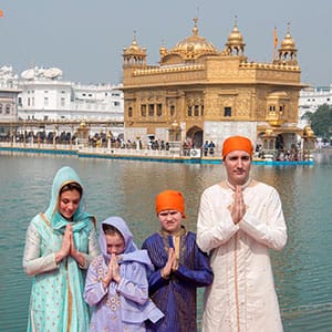 AMRITSAR, INDIA - FEBRUARY 21: Canadian Prime Minister Justin Trudeau and his wife Sophie Gregoire Trudeau with their son Xavier and daughter Ella-Grace paying obeisance, on February 21, 2018 at Golden Temple in Amritsar, India. After offering prayers inside the temple, the Trudeau's attended the traditional langar or community meal and performed kar seva at the Golden Temple's community kitchen. (Photo by Sameer Sehgal/Hindustan Times via Getty Images)