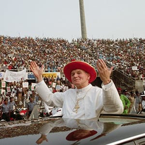 Pope John Paul II waves to the crowds during his visit to Nigeria. (Vittoriano Rastelli/Corbis/Getty Images)