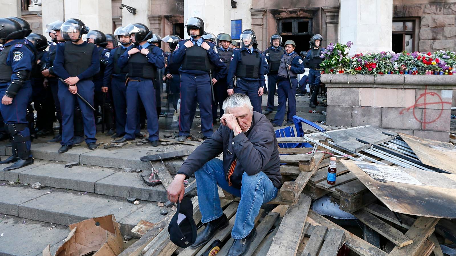 A man reacts outside trade union building, where deadly fire occurred, in Odessa