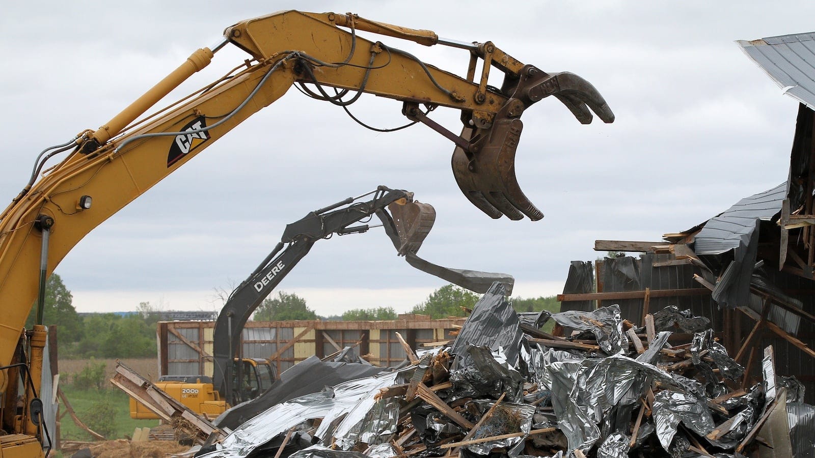 A demolition crew tears down Frank Meyers' barn in Quinte West, Ont. (Lars Hagberg/CP)