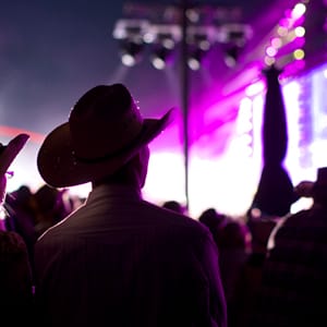 A couple watches the evening grandstand show during day two of the Calgary Stampede in Calgary