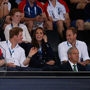 Britain's Prince William, his wife Catherine, the Duchess of Cambridge, and Prince Harry smile as they watch the artistic gymnastics competition at the 2014 Commonwealth Games in Glasgow