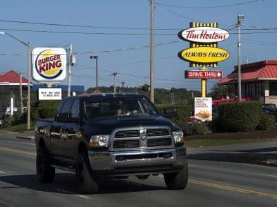 A Tim Hortons restaurant located next to a Burger King restaurant in Lower Sackville, N.S. on Monday, Aug. 25, 2014. (Andrew Vaughan/CP)