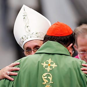 Pope Francis greets Cardinal Gerald Cyprien Lacroix of Canada during a thanksgiving mass for Canadian Saints in St.Peter's Basilica at the Vatican