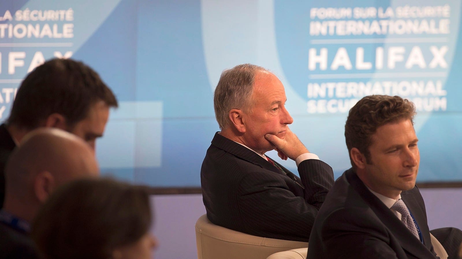 Defence Minister Rob Nicholson, centre, waits for the start of the opening session at the Halifax International Security Forum on Friday, November 21, 2014. (Andrew Vaughan/The Canadian Press)