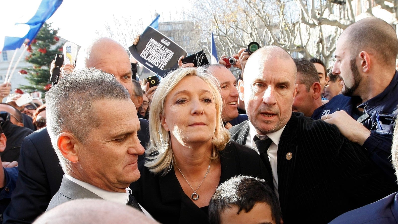 French far-right Front National leader Marine Le Pen, centre, walks with the crowd during a march for the victims of the recent shootings in France, while in Beaucaire, southern France. (AP Photo/Claude Paris)