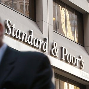 A man walks past the ratings agency Standard & Poors' building in New York's financial district