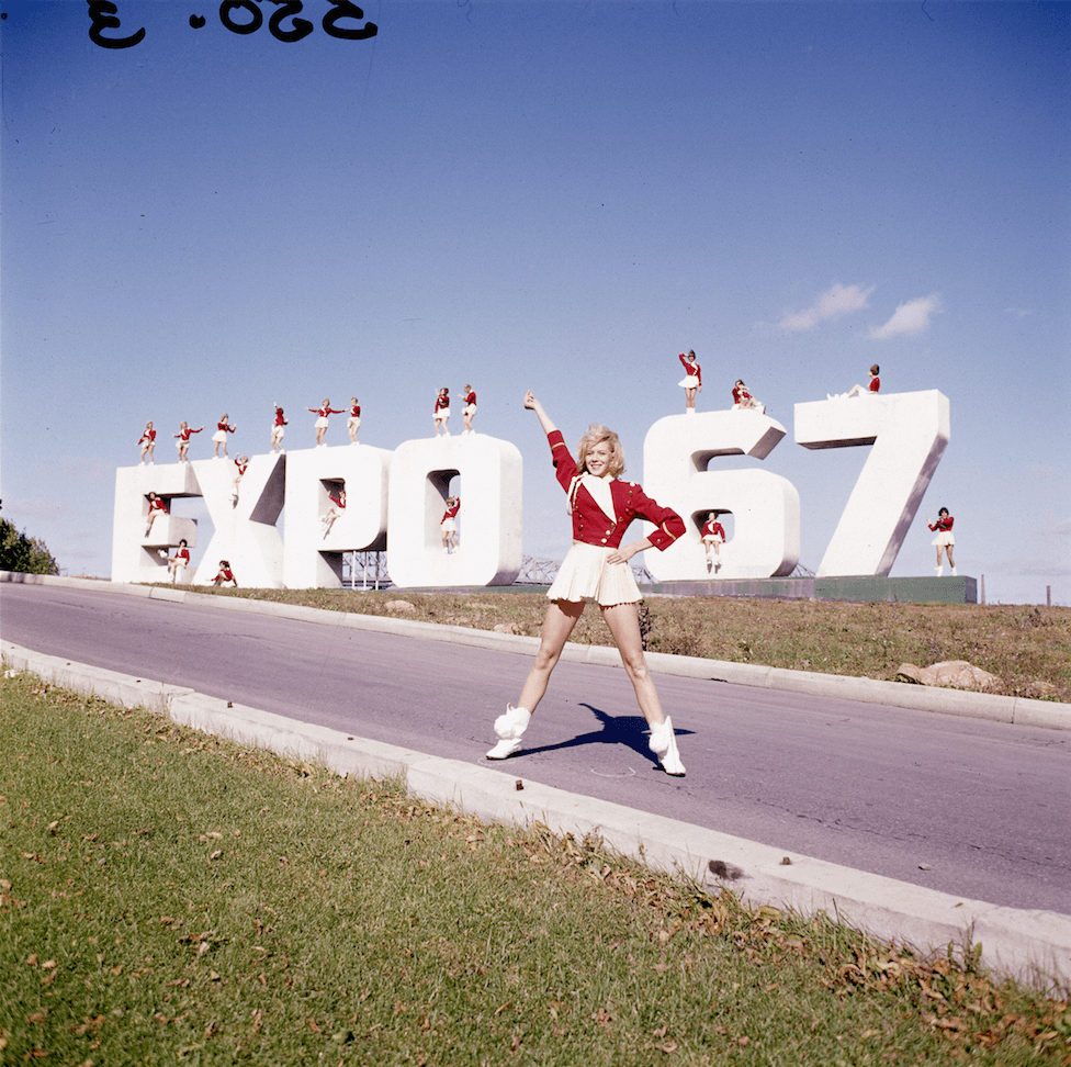 What we know: Majorettes pose with the entrance sign for the Expo 67 world fair held in Montreal.
What we need: Help us locate any of the Majorettes pictured.
(Mikan/Library and Archives Canada)