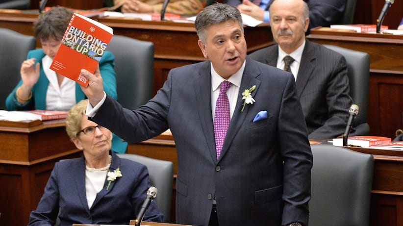 Ontario Finance Minister Charles Sousa delivers the provincial budget as Premier Kathleen Wynne looks on at Queen's Park in Toronto on Thursday, April 23, 2015. THE CANADIAN PRESS/Nathan Denette