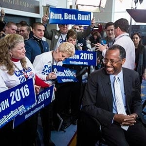 Dr. Ben Carson speaks to supporters before an interview after speaking at the Conservative Political Action Conference in National Harbor, Md.