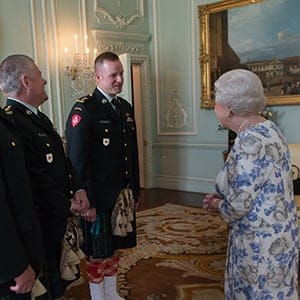 Queen Elizabeth II, in her capacity as Colonel-in-Chief of the Argyll and Sutherland Highlanders of Canada, receives (from left) Colonel Ronald Foxcroft (Honorary Colonel), Lieutenant Richard Kennedy (Honorary Lieutenant Colonel) and Lieutenant Colonel Lawrence Hatfield (Commanding Officer) at Buckingham Palace in London. Stefan Rousseau/PA