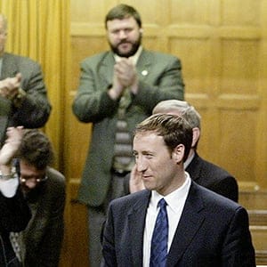 Newly elected Conservative leader Peter MacKay (R) receives a standing
ovation from the caucus in the House of Commons in Ottawa, June 2,
2003. MacKay, who worked out a controversial deal with leadership rival
David Orchard to secure the fourth ballot victory, replaces outgoing
leader Joe Clark (L). Jim Young/Reuters