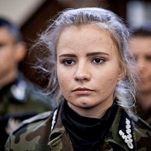 A young female member of Strzelec (The Shooter), a paramilitary association, during an oath taking ceremony. Since the start of war in Ukraine, membership of paramilitary associations has grown. (Piotr Malecki/Panos Pictures)