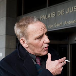 Plaintiff Daniel C. Charest smokes a cigarette outside the Montreal courthouse, Monday, March 12, 2012, on the opening day of a massive lawsuit against the tobacco industry. Graham Hughes/CP