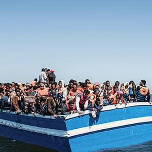 May 29, 2015 - Strait of Sicily: The ship Spica Italian Navy, with a crew of only 60 men, rescued over 1,000 migrants in international waters 30 miles off Libya. The refugees who were rescued, among them 200 children, women, men and the elderly, are from Eritrea and Syria. More than 5,000 migrants trying to reach Europe have been saved from boats in distress in the Mediterranean between May 29 and June 2, and operations are in progress to rescue 500 more. In some of the most intense Mediterranean traffic of the year, migrants who left Libya in 25 boats were picked up by ships from Italy, Britain, Malta and Belgium, assisted by planes from Iceland and Finland.(Fabrizio Villa/Polaris)