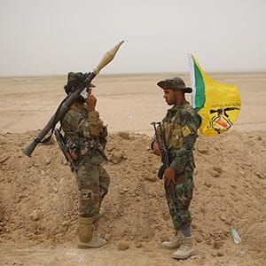 fighters of Kataeb Hizbullah of Popular Mobilization stand on guard in the Desert near Ankur village east of Anbar province on May 28, 2015 in Anbar, Iraq
(Ahmad Mousa/The Washington Post/Getty Images)