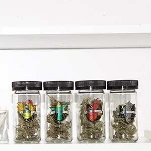 Jars of luxury medical marijuana from Hydropothecary sit on a bathroom shelf in a medicine cabinet (Photograph by Michelle Yee)