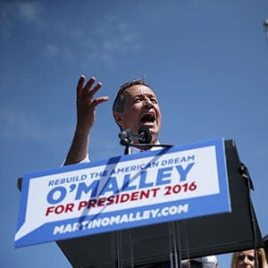 BALTIMORE, MD - MAY 30: Former Maryland Gov. Martin O'Malley (L) speaks as his wife Katie (R) looks on during an event to announce his candidacy for a presidential campaign May 30, 2015 at Federal Hill Park in Baltimore, Maryland. O'Malley was the third Democrat, after former U.S. Secretary of State Hillary Clinton and Sen. Bernie Sanders (I-VT), to throw his hat in the ring for the Democratic nomination. (Alex Wong/Getty Images)
