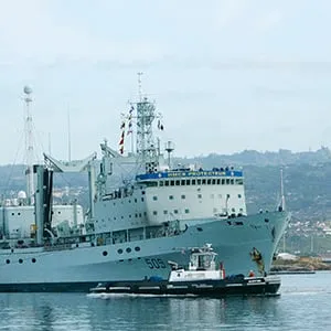 The Royal Canadian Navy ship HMCS Protecteur arrives at Joint Base Pearl Harbor Hickam after it was towed by the U.S. Navy ship USS Sioux after a fire disabled it while at sea in Honolulu, Hawaii, March 6,2014. (Hugh Gentry/Reuters)