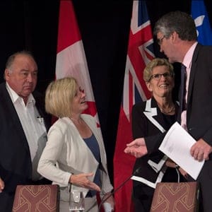 Northwest Territories Premier Bob McLeod, Albert Premier Rachel Notley, Ontario Premier Kathleen Wynne and Nova Scotia Premier Stephen McNeil, left to right, bid their farewells at the closing news conference of the summer meeting of Canada's premiers in St. John's on Friday, July 17, 2015. Andrew Vaughan/CP