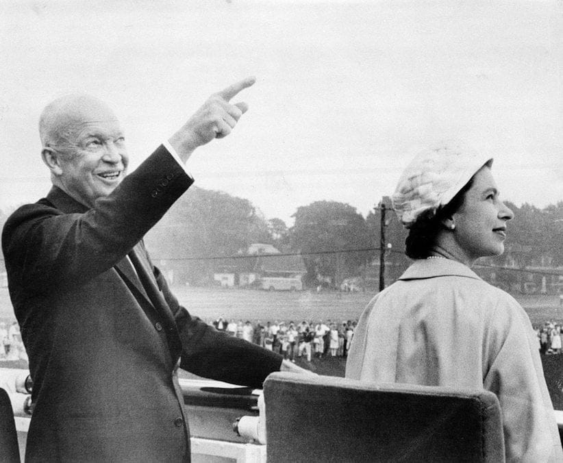 U.S. President Dwight Eisenhower gestures June 26,1959 as he points out features of the St. Lawrence Seaway to England's Queen Elizabeth II . The two heads of state were sailing along the seaway aboard the royal yacht Britannia, following ceremonies marking the official opening of the vital waterway. (AP Photo)