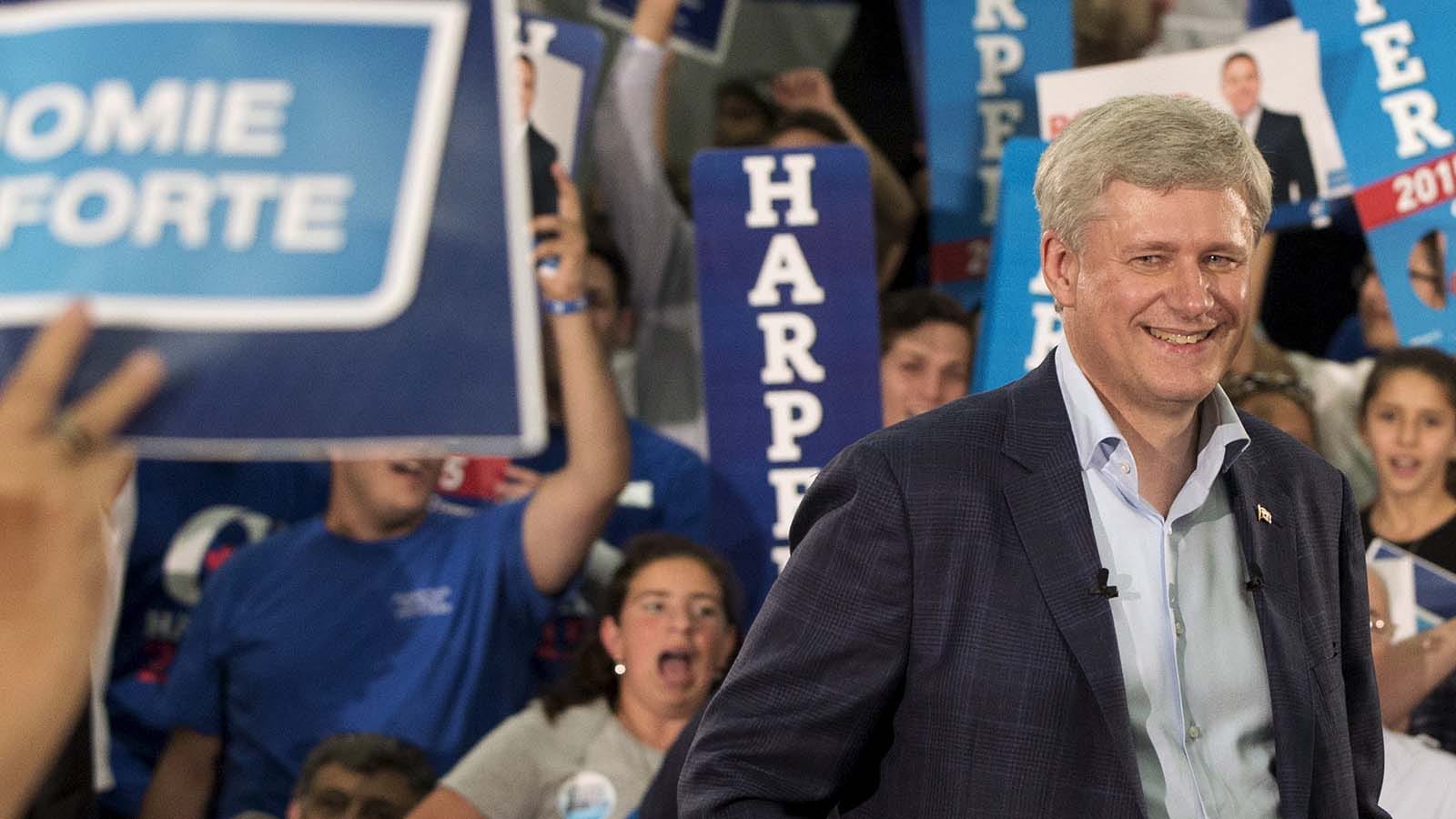 Canadian Prime Minister Stephen Harper speaks to supporters during a rally in Montreal, Quebec, Canada August 2, 2015. Canadian Prime Minister Stephen Harper on Sunday called a parliamentary election for Oct 19, kicking off a marathon 11-week campaign, the longest federal election campaign in recent history. REUTERS/Christinne Muschi - RTX1MS1E