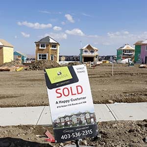 A sold sign is seen at an empty lot in a new sub division in Calgary, Alberta, April 7, 2015. House prices have fallen in Calgary after the price of oil plummeted late last year according to local media. (Todd Korol/Reuters)