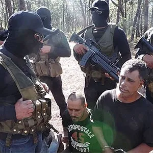 Members of the Jalisco New Generation cartel (CJNG) record themselves with prisoners from a rival cartel. YouTube