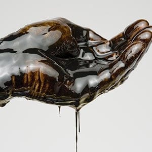 Hand Full of Oil. Getty Images