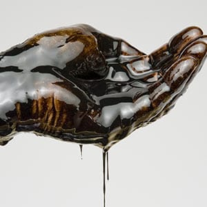 Hand Full of Oil. Getty Images
