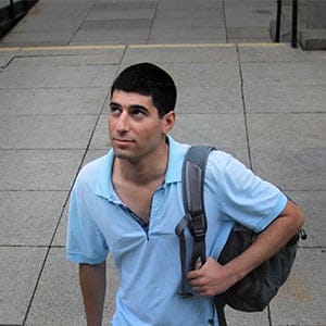Adam Schacner is photographed standing on some loose concrete paving stones between the Trottier building and the Rutherford Building on the McGill campus in downtown Montreal. The Trottier building houses some of the engineering department. September 13th 2015. (Photograph by Roger LeMoyne)