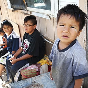 Children outside the trailer of Richard Andrews in Wasagamack First Nation. It is in filthy condition, has mold and is overpopulated by over 13 people living inside. It has no running water- See Mary Agnes No Running Water Feature ñ August 18, 2011. (Joe Bryska/Winnipeg Free Press)