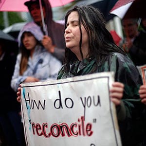 TORONTO, ON-MAY 31 - Cathy Stronghearted Woman listens during a drum circle at Queen's Park in the Walk for Reconciliation in Toronto, May 31, 2015. It was one of several such events across Canada on Sunday leading up to the Truth and Reconciliation Commission's report on Tuesday. (Marta Iwanek/Toronto Star/Getty Images)