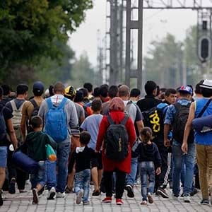 Syrian refugees walk towards Greece's border with Macedonia, near the Greek village of Idomeni, September 11, 2015. Some 7,600 migrants, many of them refugees from the Syrian war, entered Macedonia from Greece between 6 p.m. (1600 GMT) on Wednesday and 6 p.m. on Thursday, an official with the United Nations refugee agency said on the border. (Yannis Behrakis/Reuters)