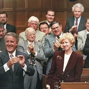Kim Campbell, Leader of the Conservative Party and Prime Minister designate is given a standing ovation in the House of Commons by Prime Minister Brian Mulroney and other members of the government on June 16, 1993. (Tom Hanson/CP)