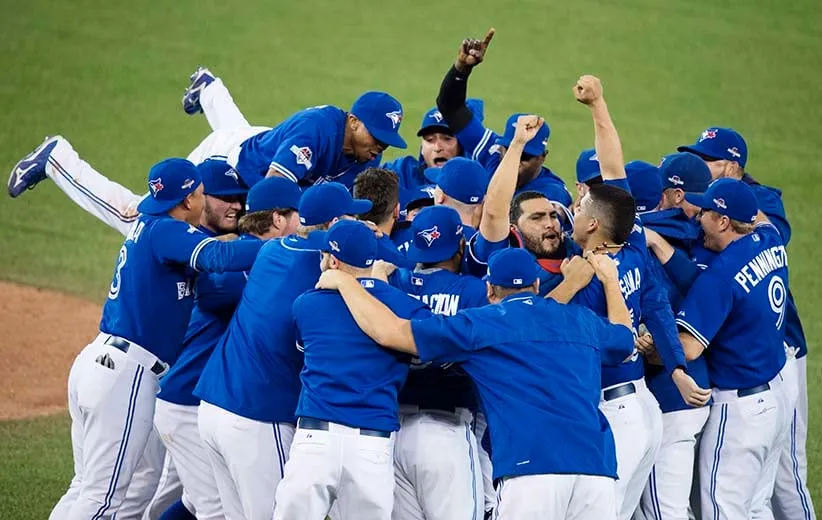 Members of the Toronto Blue Jays celebrate their series win over the Texas Rangers during game five American League Division Series baseball action in Toronto on Wednesday, October 14, 2015. THE CANADIAN PRESS/Darren Calabrese
