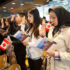 Oct 6 2015--Vancouver BC--Citizenship ceremony: New Canadians take the citizenship oath during a ceremony in Vancouver. (Photographs by Brian Howell)