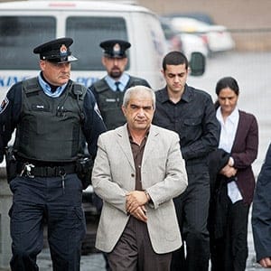 KINGSTON, ON. DECEMBER 5, 2011-- Mohammad Shafia (l), eldest son Hamed Shafia and Tooba Mohammad Yahya ( back) exit a police van and are escorted to the Kingston Courthouse on Monday December 5, 2011. He along with his dad and mother are accused of killing the teenage Shafia sisters and Shafia's first wife in a polygamous marriage over family honour.
MACLEAN' S PHOTO BY Vincenzo D'Alto