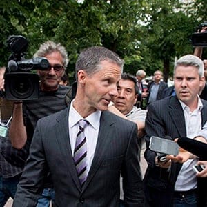 Nigel Wright, former Chief of Staff to Prime Minister Stephen Harper, leaves the courthouse in Ottawa after his first day of testimony in the trial of former Conservative Senator Mike Duffy on Wednesday, Aug. 12, 2015. Duffy is facing 31 charges of fraud, breach of trust, bribery, frauds on the government related to inappropriate Senate expenses. (Justin Tang/CP)