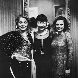 (L-R) Actresses Marlene Dietrich and Anna May Wong w. filmmaker Leni Riefenstahl at Berlin Ball. (Alfred Eisenstaedt/The LIFE Picture Collection/Getty Images)